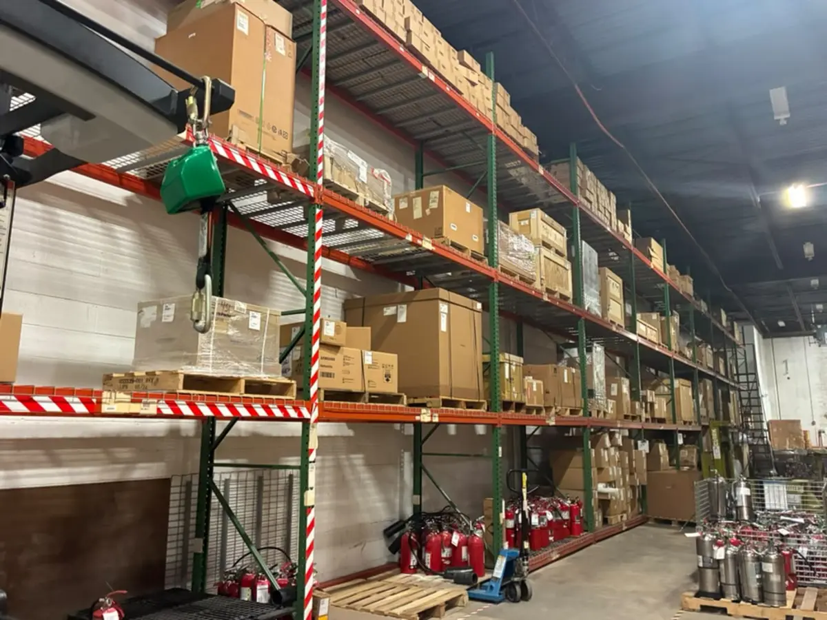 Palletized freight staged in racked bays at the Rush 24/7 warehouse